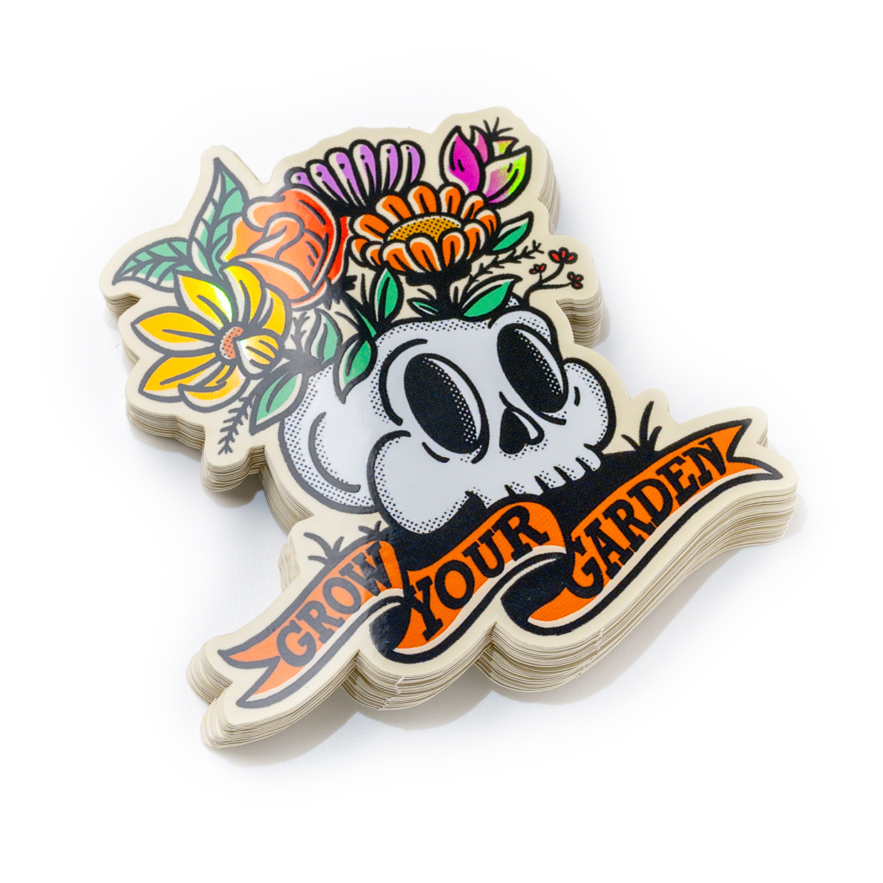 Sticker of a skull with colorful flowers growing from it, and a banner reading "Grow Your Garden" below.