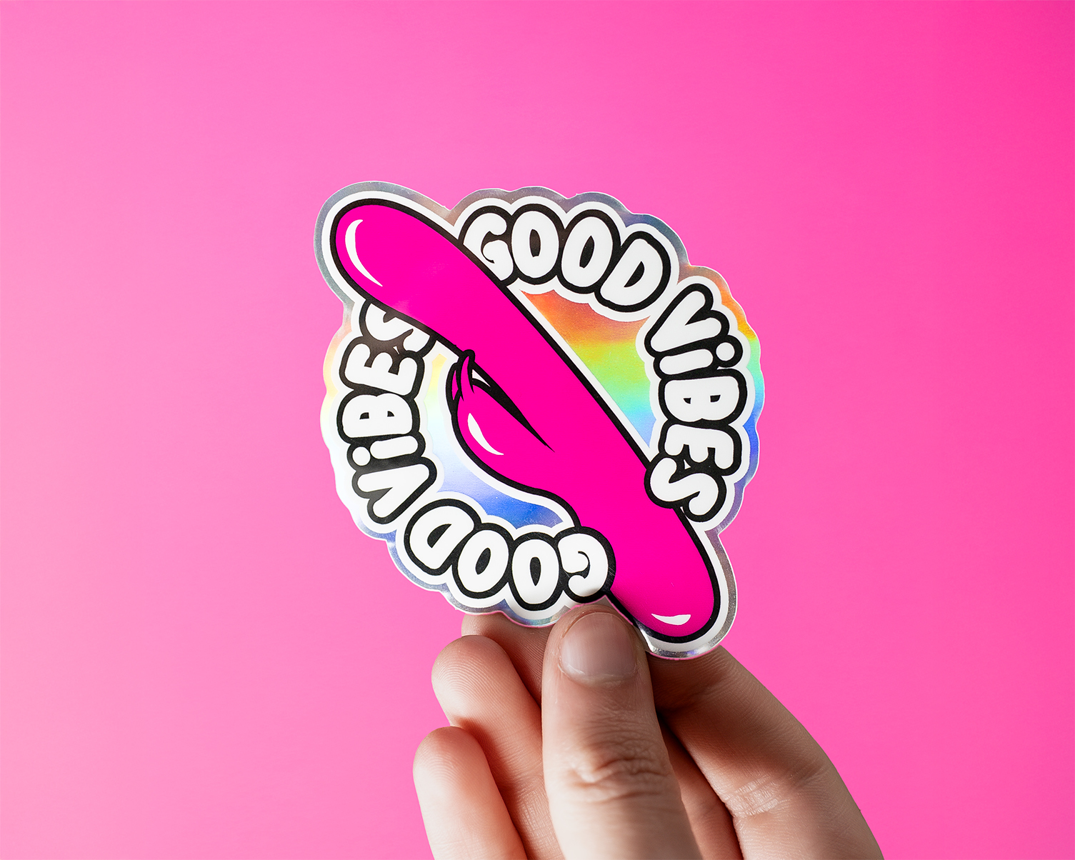 Pink vibrator printed on holographic, with the text "good vibes"